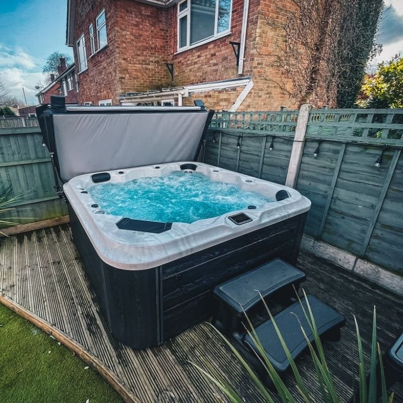 H2O Tubs 6000 Series 32A Eco Range Hot Tub Corner View Customer Light With Cover Open