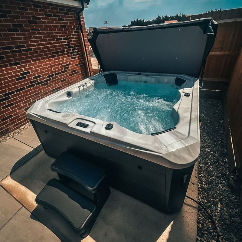 H2O Tubs 7000 Series 32A Eco Hot Tub White Marble Customer Photo with Steps and Cover
